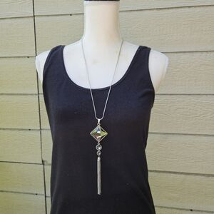 long silver tone chain necklace with tiered gray pendant and tassel